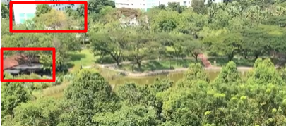 A small building and an HDB block in the background